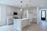 open kitchen with wood floors and island