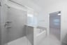 primary bathroom with soaking tub and walk-in shower