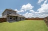 backyard with grass and covered patio