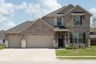 two-story home with brick and stone exterior