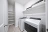 laundry room with included washer and dryer
