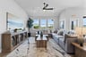 open great room with hardwood flooring and windows