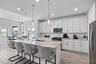 open kitchen with white cabinets