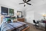 guest bedroom with carpet and ceiling fan