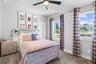 guest bedroom with windows