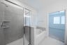 primary bathroom with soaking tub and walk-in shower