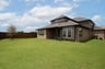backyard with grass and covered patio