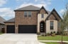 two-story home with brick and stone exterior