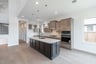 open kitchen with wood floors and island