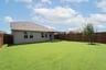 backyard with grass and covered patio