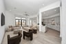 open great room with tall ceilings and windows