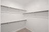 closet with hanging racks and closet 