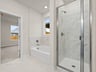 Primary bath with a soaking tub and walk-in shower