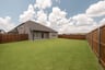 backyard with grass and covered patio