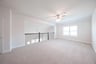 open gameroom with carpet and ceiling fan