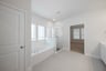 primary bathroom with soaking tub and walk-in shower