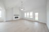 open great room with wood floors and fireplace