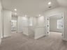 loft with carpet, sloped ceiling and stairs 
