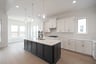kitchen with large island and white cabinets 