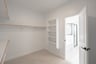 closet with hanging racks and shelves 