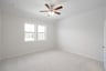 bedroom with carpet and ceiling fan 