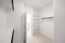 closet with carpet and shelves 