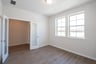 study with wood flooring and french doors 