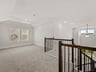 game room with carpet, windows and sloped ceilings