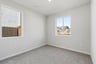 bedroom with gray carpet, white walls, two windows, and recessed ceiling light