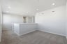 loft with gray carpet, white walls, and recessed ceiling lights