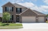 two-story home with brick and shutters