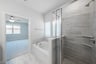 primary bathroom with soaking tub and walk-in shower
