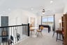 loft with carpet and ceiling fan 