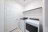 laundry room with included washer and dryer