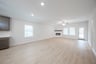 open great room with wood floors and fireplace