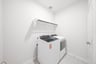 laundry room with tile floors, washer, and dryer