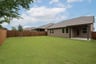 backyard with grass and covered patio