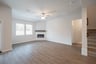 open great room with wood floors and fireplace