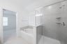 primary bathroom with soaking tub and walk-in shower