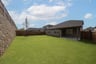 backyard with grass and covered patio