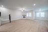 open great room with wood floors and fireplace