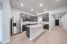 open kitchen with wood floors and island