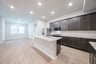 open kitchen with wood floors and island