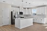 kitchen with white cabinets and a center island