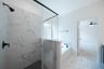 primary bathroom with soaking tub and walk-in shower