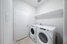 laundry room with included washer and dryer