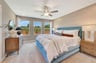 primary bedroom with three windows