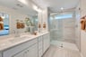 primary bathroom with an oversized shower