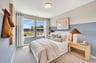 secondary bedroom with two windows