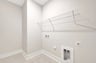 laundry room with a wire shelf